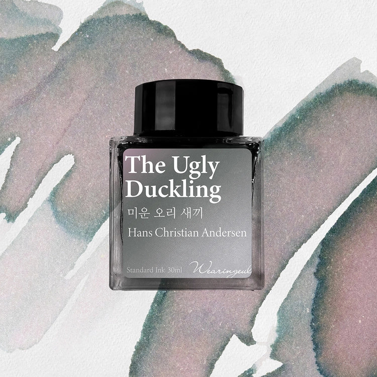 Wearingeul The Ugly Duckling fountain pen ink bottle with light gray ink swatch background
