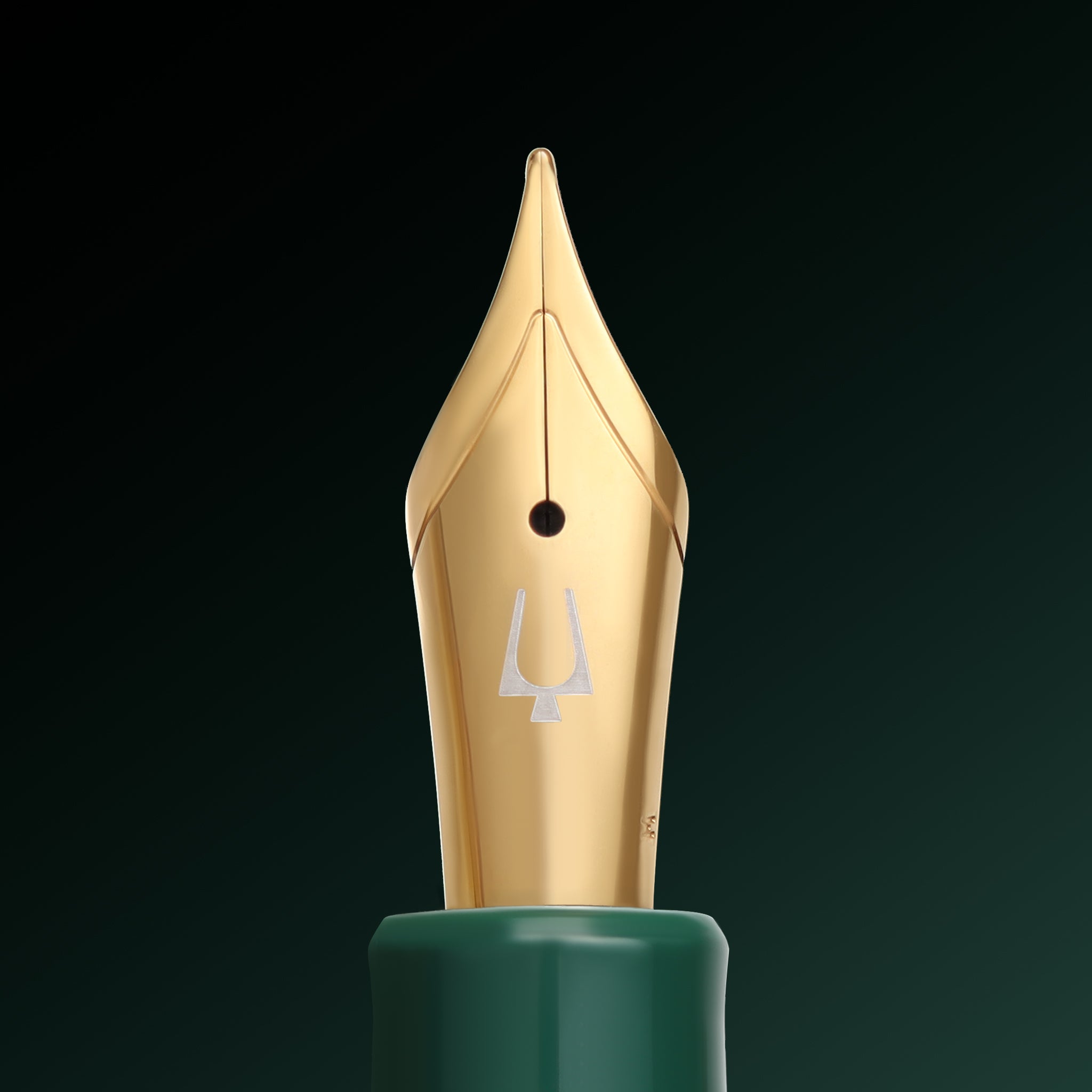Gold-plated nib of the Esterbrook x Accutron Spaceview Estie fountain pen, engraved with the Accutron tuning fork emblem