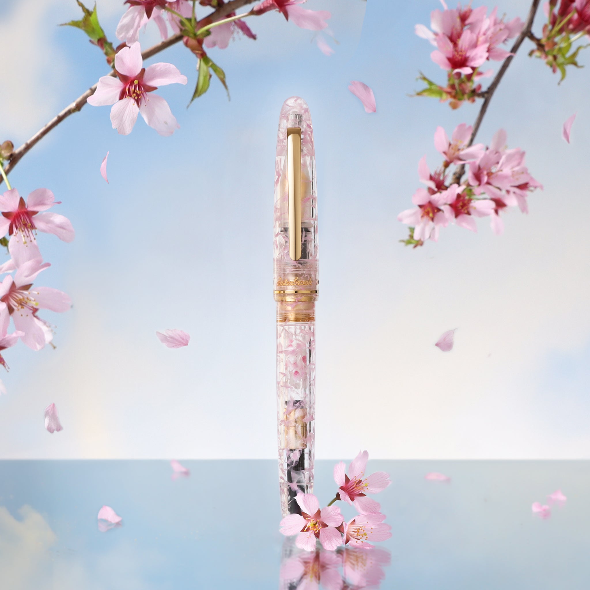 Beautiful acrylic pen with pink crackled detail and surrounding cherry blossoms