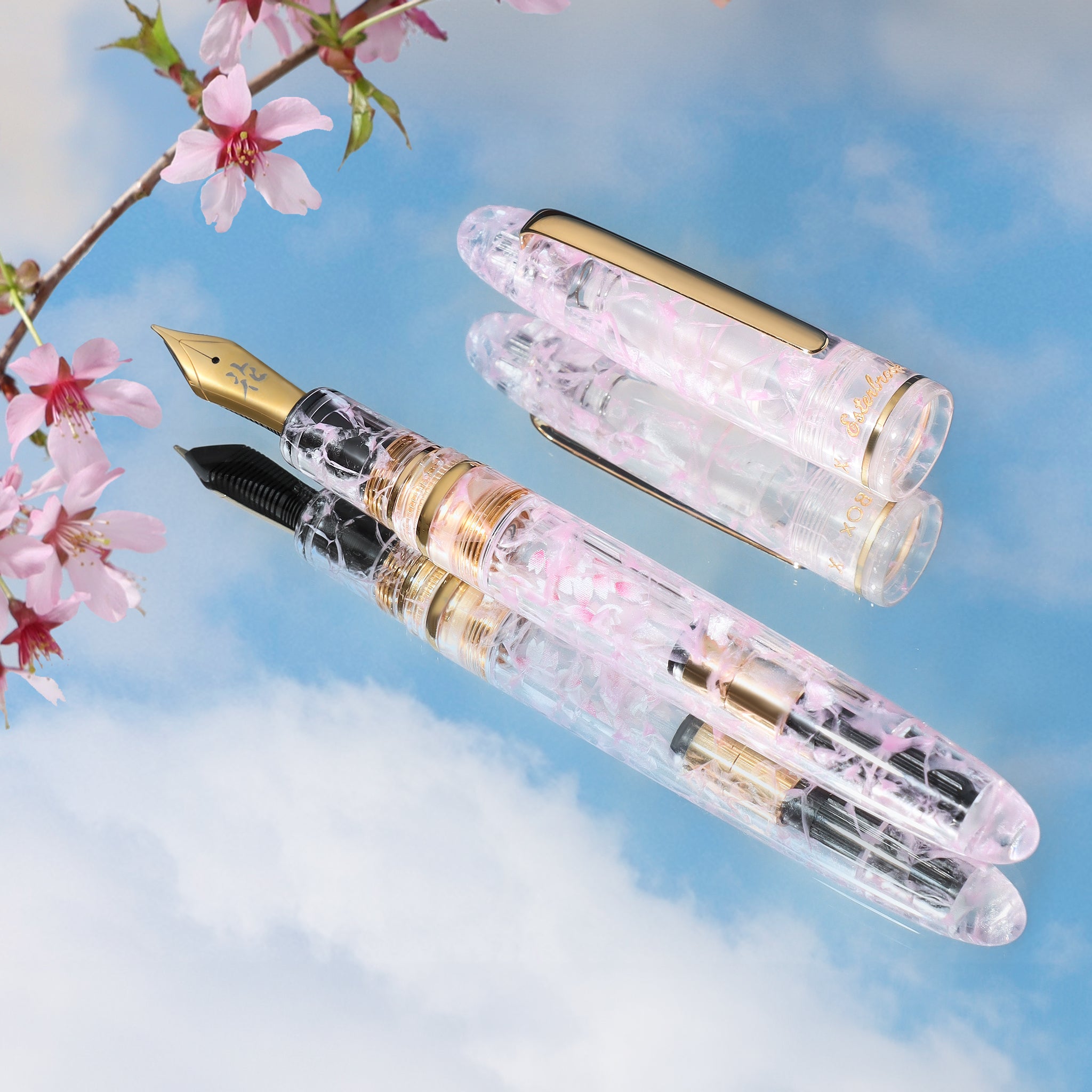 Beautiful acrylic pen with pink crackled detail and surrounding cherry blossoms