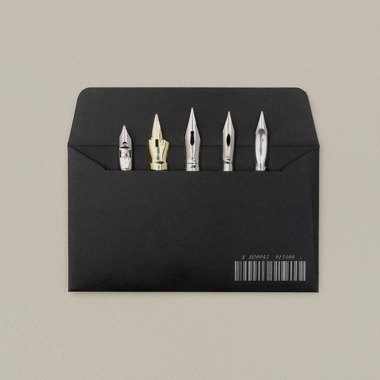 Black envelope with selection of nibs