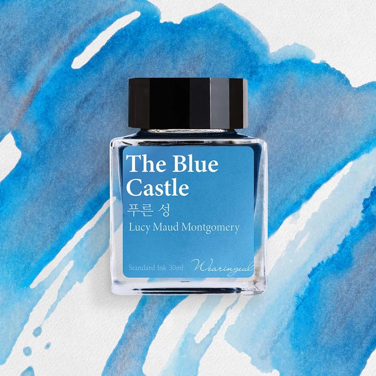 Wearingeul The Blue Castle fountain pen ink bottle with sky blue ink swatch background