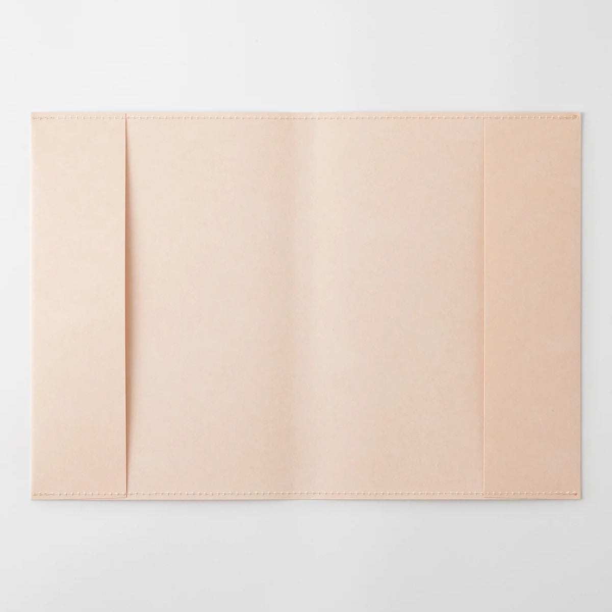 MD Notebook A5 paper cover opened flat, showing the light pink Cordoba paper and the fold-in flaps