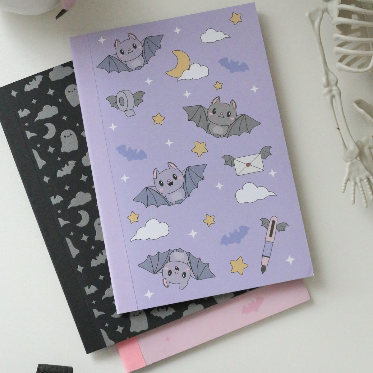 Esterbrook x Sweet Kawaii Design Pastel Halloween A5 notebook set: purple grid, pink blank and black lined notebooks together