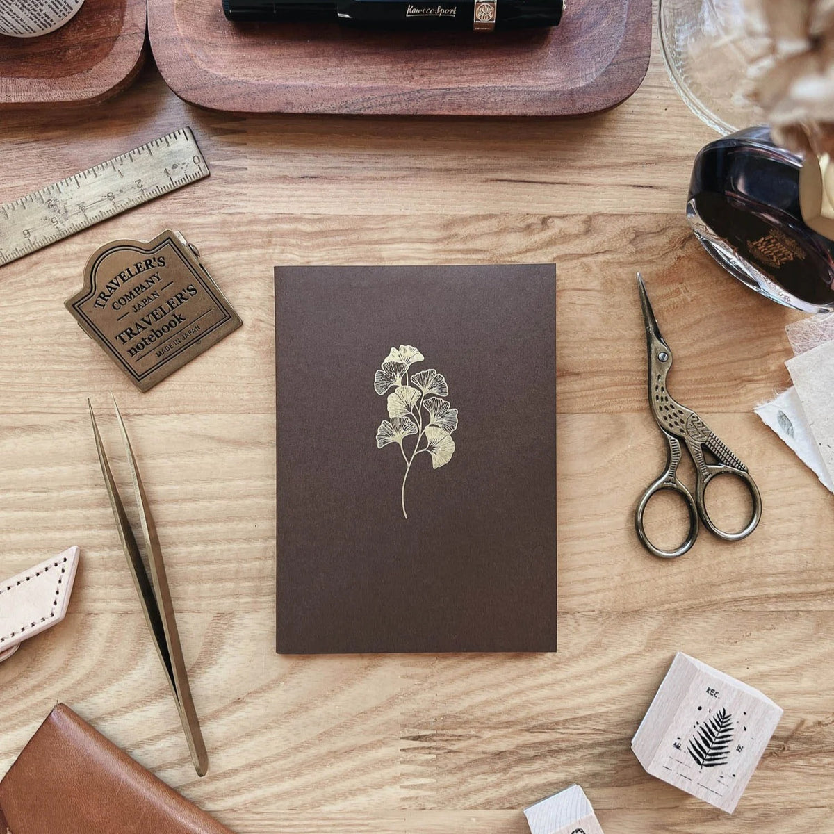 Sarica Studio Ginkgo Notebook, passport TN size, chestnut brown cover with a gold debossed ginkgo design, with ink bottles and scissors
