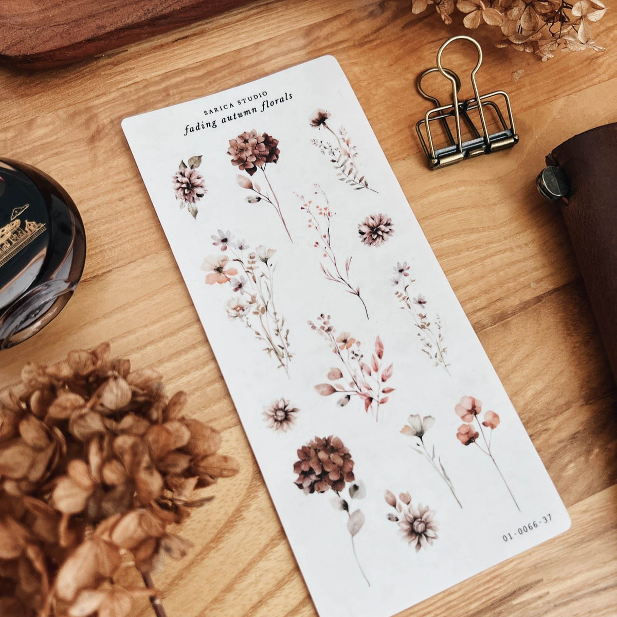 Sarica Studio Fading Autumn Floral sticker sheet shown at an angle with dried hydrangeas