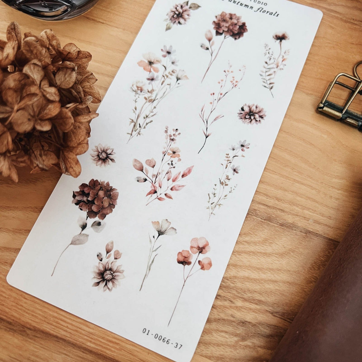 Close-up of Sarica Studio Fading Autumn Floral stickers of dried flowers in dusty rose, rust and brown