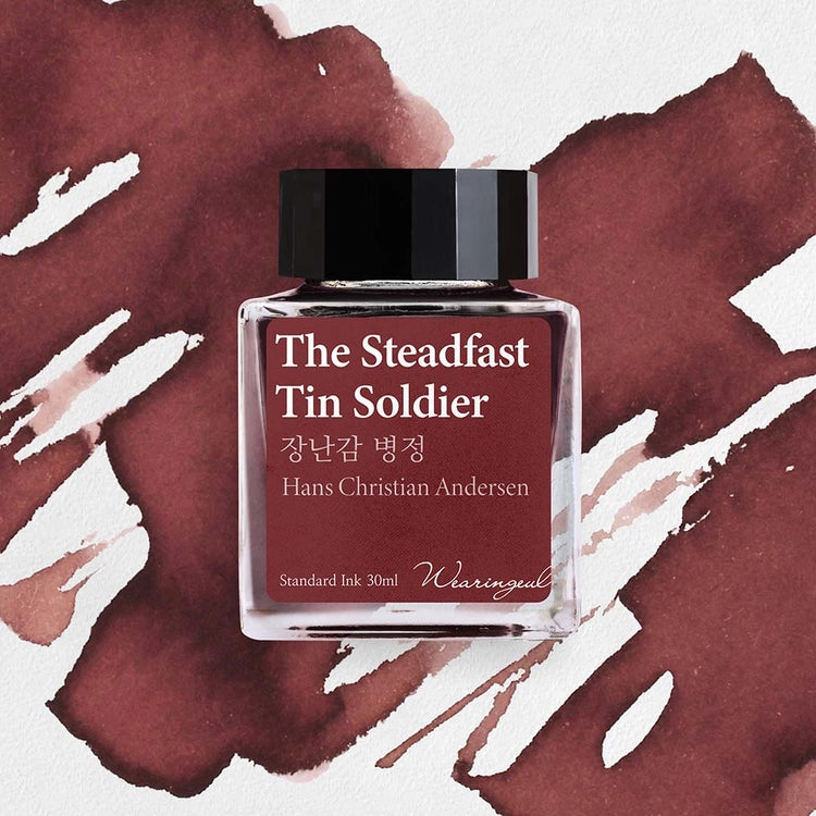 Wearingeul The Steadfast Tin Soldier fountain pen ink bottle with reddish brown ink swatch background
