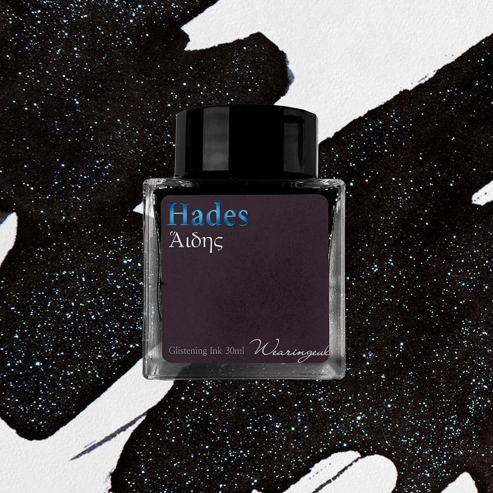 Wearingeul Hades shimmer fountain pen ink, 30ml bottle, on a black swatch with blue shimmer