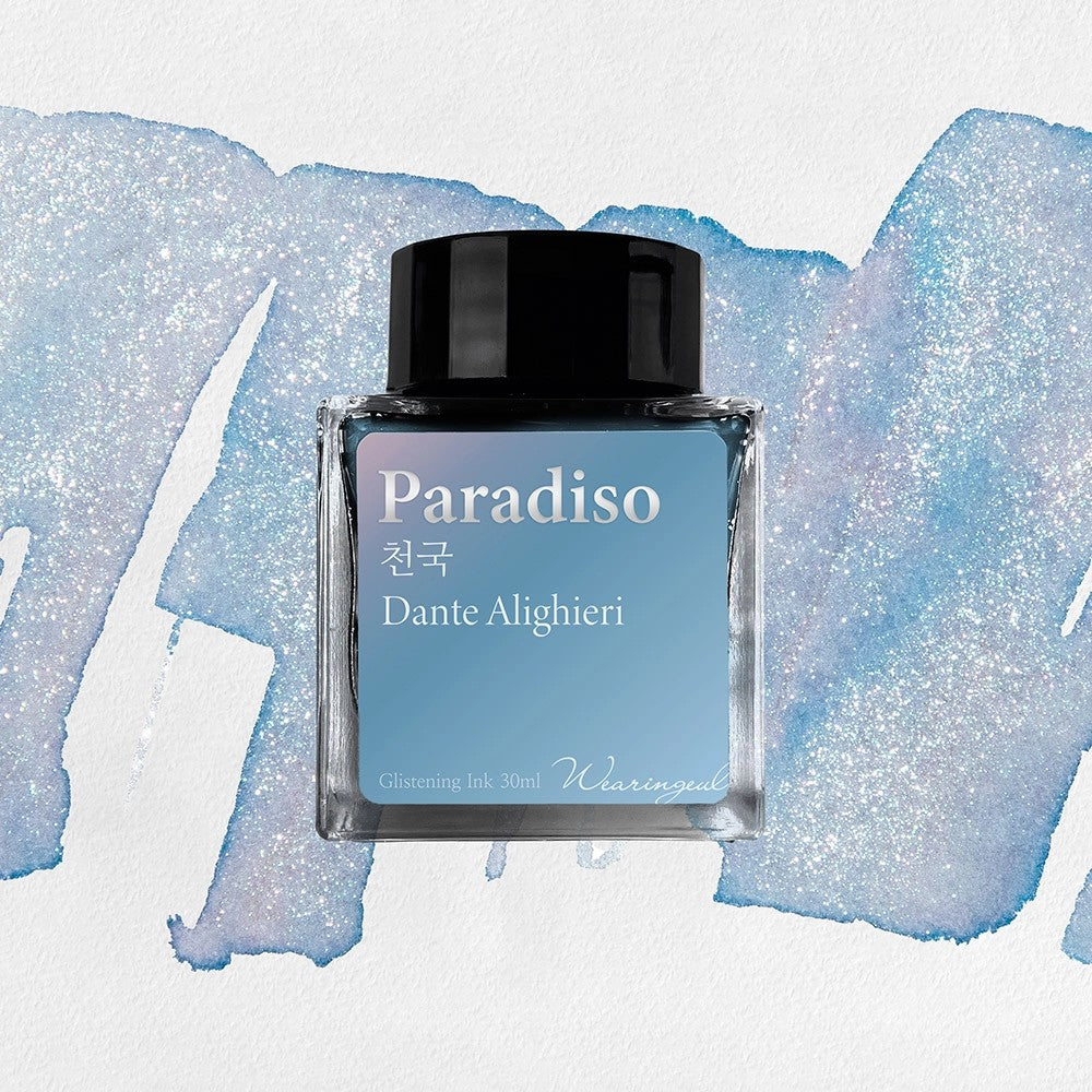 Wearingeul Paradiso shimmer fountain pen ink, 30ml bottle, on a pale blue swatch with silver shimmer