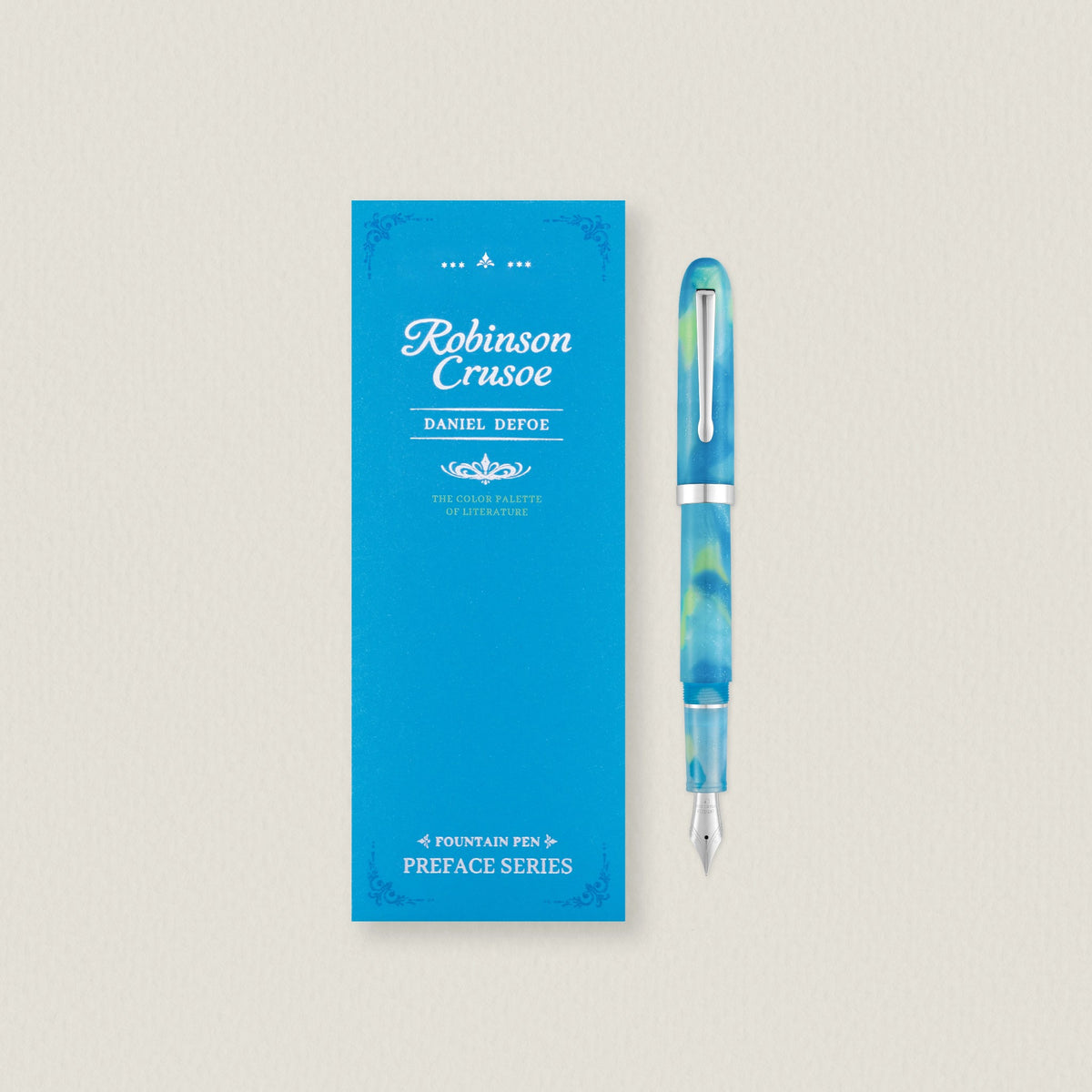 Wearingeul Robinson Crusoe Preface fountain pen in marbled turquoise and yellow-green acetate beside its blue sleeve