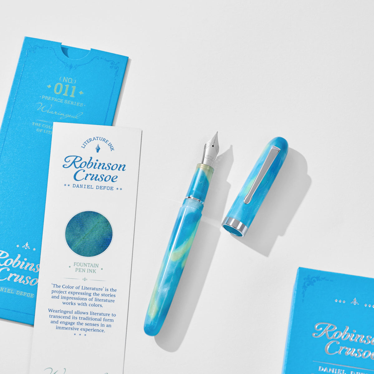 Wearingeul Robinson Crusoe Preface fountain pen uncapped with steel nib, beside its literature card and packaging