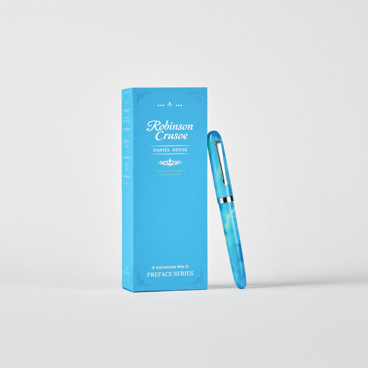 Wearingeul Robinson Crusoe Preface fountain pen, capped, standing beside its blue box