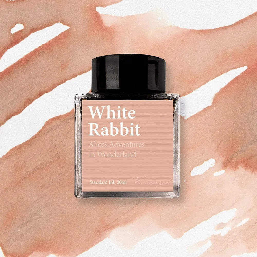 Wearingeul White Rabbit fountain pen ink, 30ml bottle, on a soft peach swatch