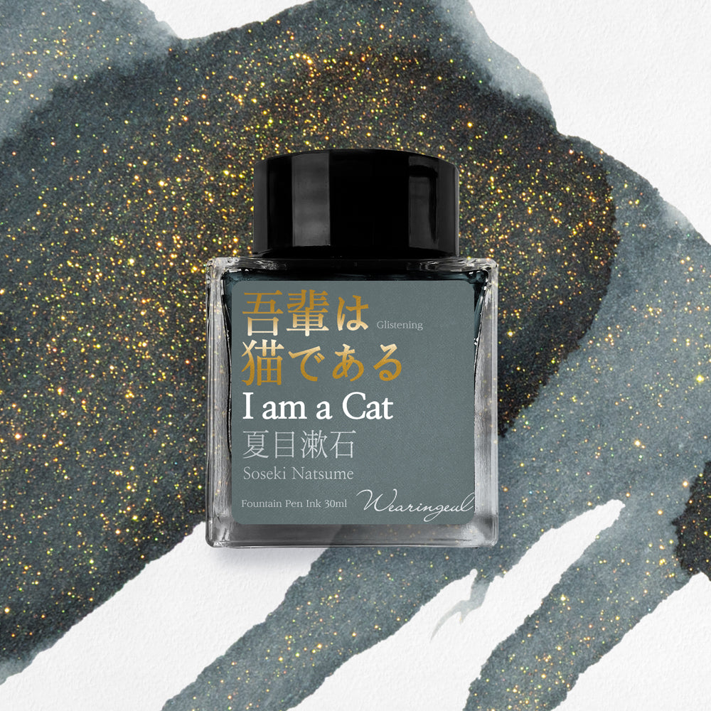 Wearingeul I am a Cat fountain pen ink bottle with gray glitter ink swatch background