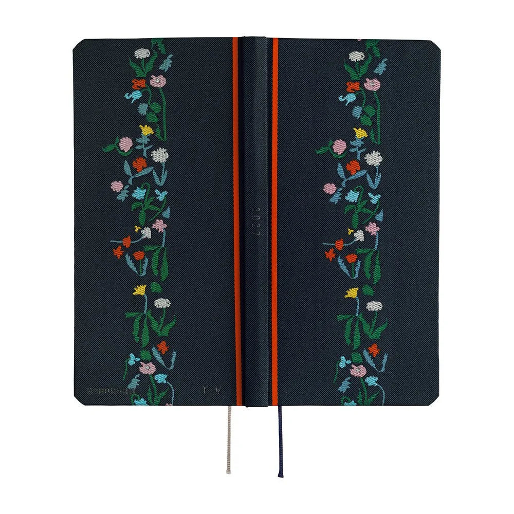 Hobonichi Techo 2027 Weeks planner, Yoshie Watanabe Petit Bloom — laid flat showing the navy fabric cover across front, spine and back
