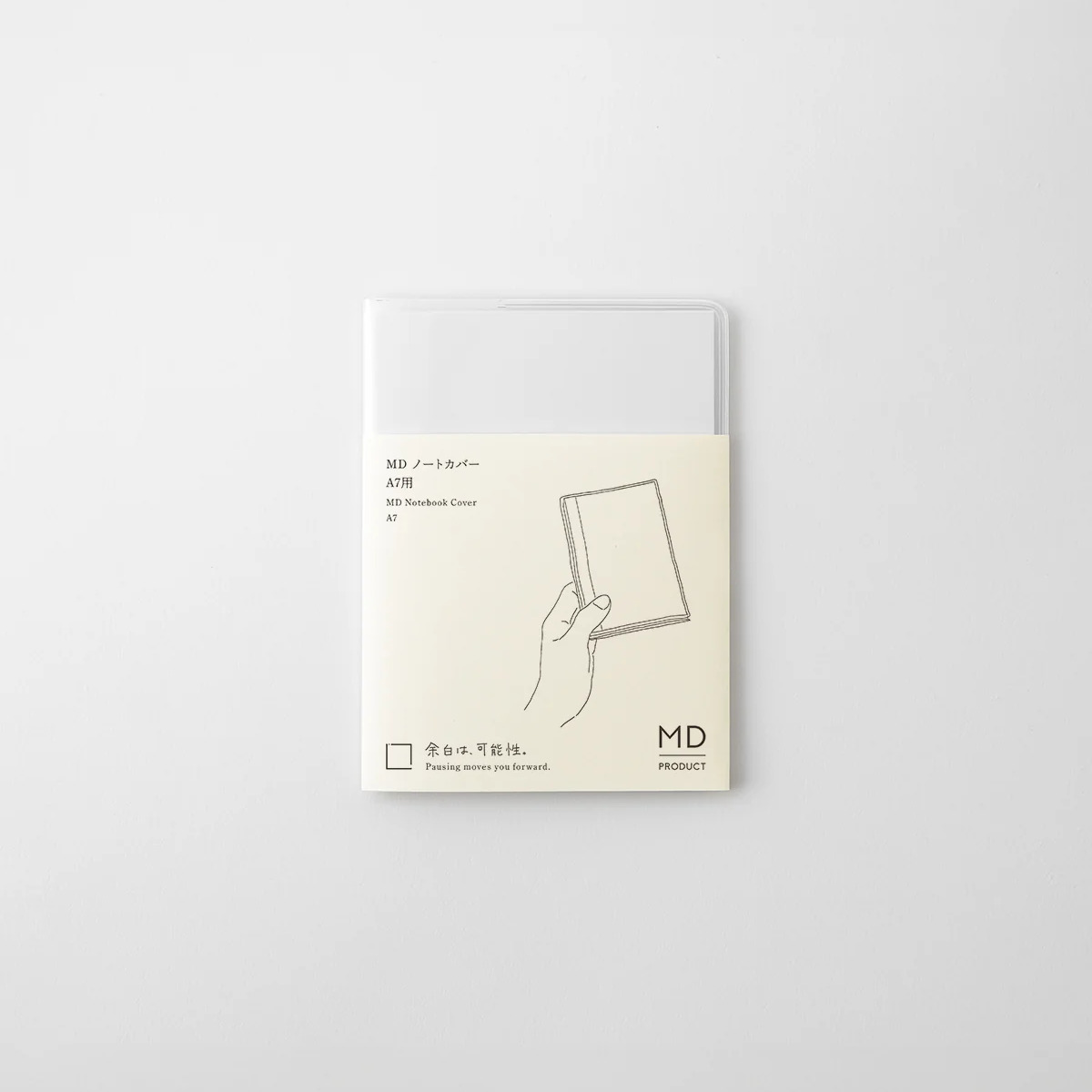 MD Notebook Cover A7 in its packaging, a clear PVC cover with the MD Product paper band