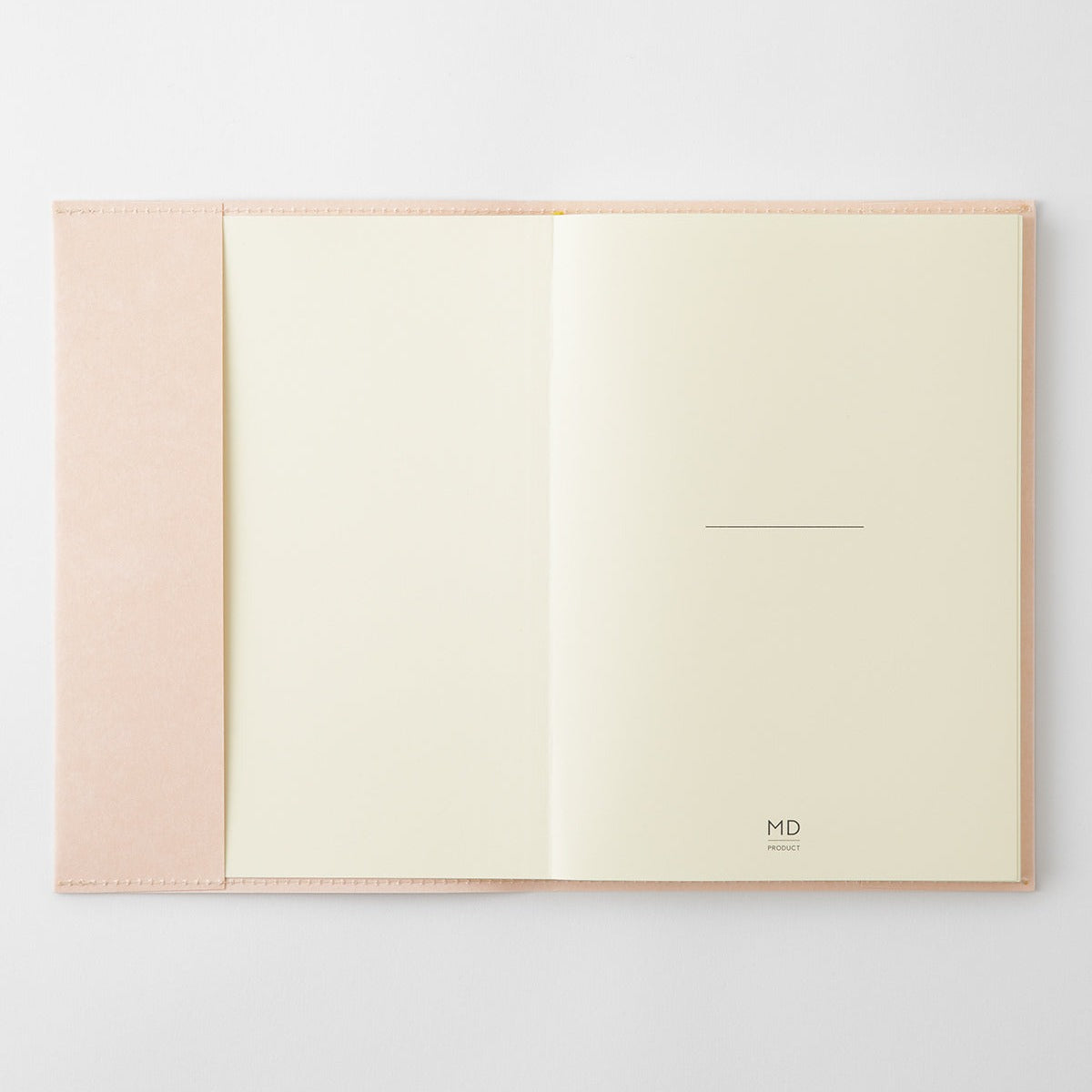MD Notebook A5 paper cover open with an MD Notebook inside, showing the cream MD Paper pages